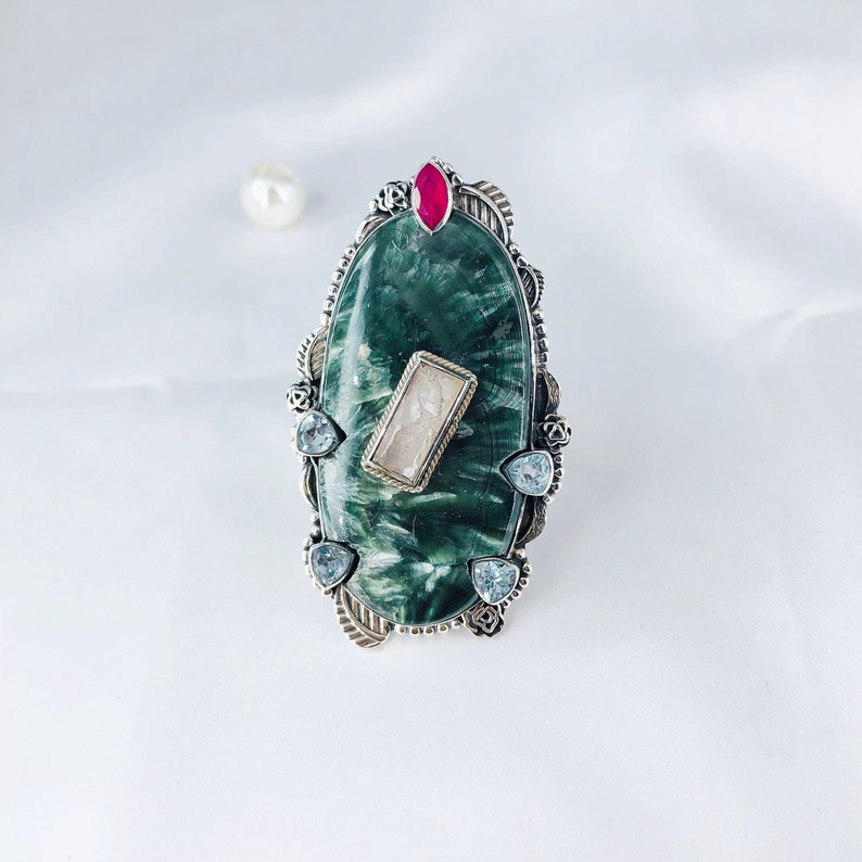Natural Seraphinite, Ruby, Rose Quartz And Blue Topaz Ring By Harshita Jewellery